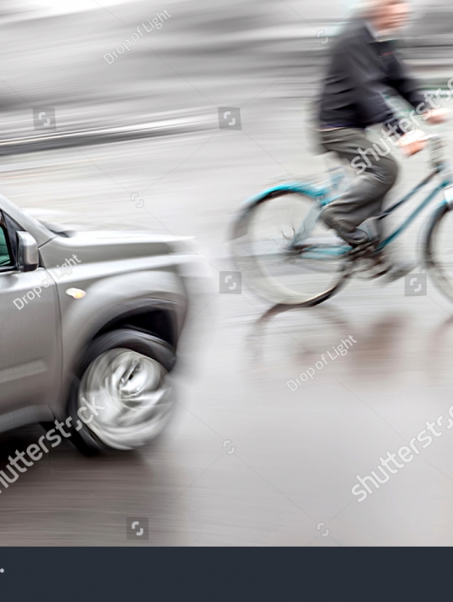 stock-photo-dangerous-city-traffic-situation-with-a-cyclist-and-cars-intentional-motion-blur-162618482